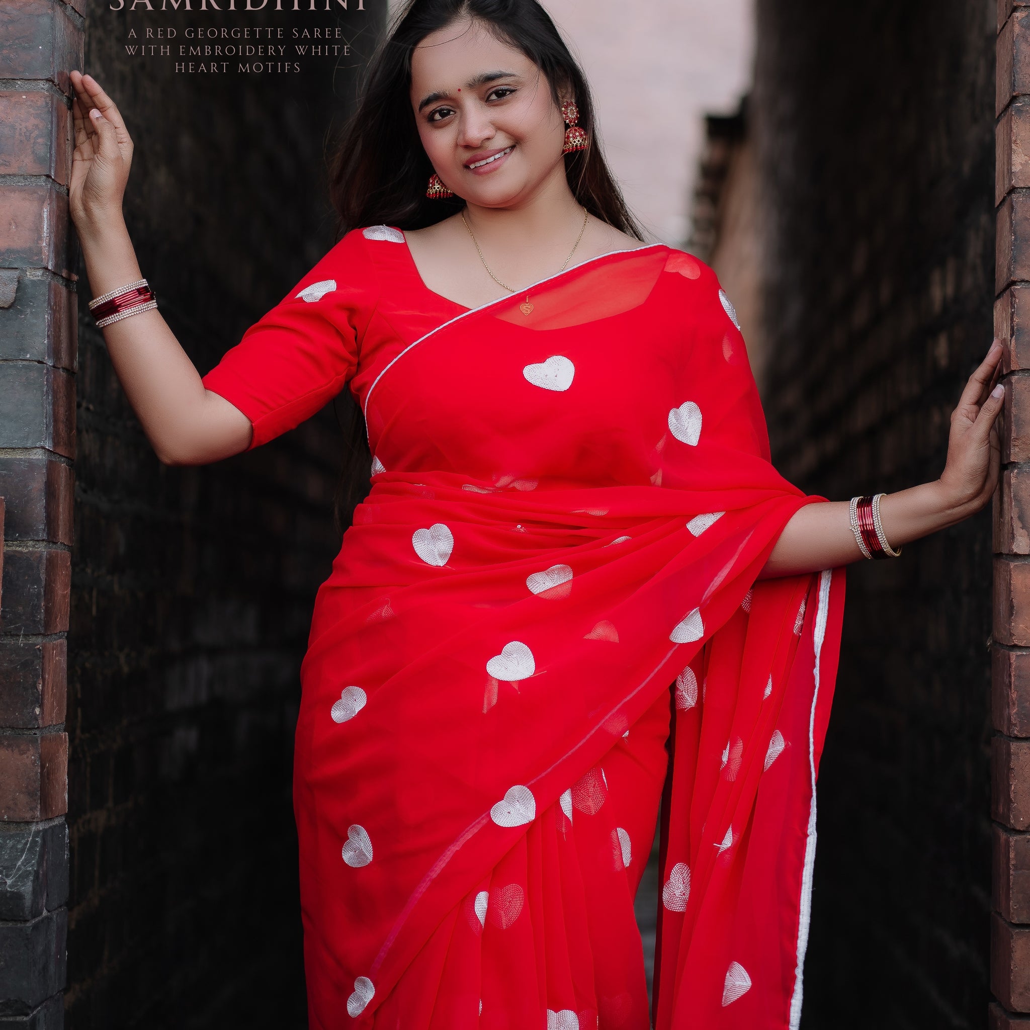 A Red Georgette Saree with embroidery White Heart Motifs❣️