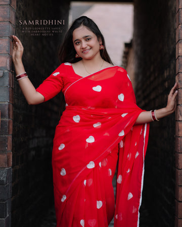 A Red Georgette Saree with embroidery White Heart Motifs❣️