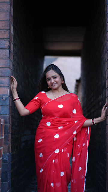 A Romantic Red Georgette Saree with embroidery White Heart Motifs