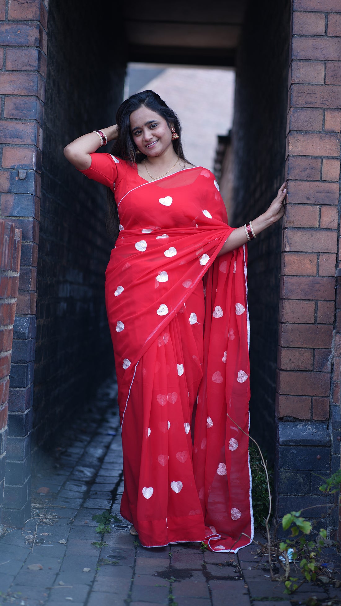 A Romantic Red Georgette Saree with embroidery White Heart Motifs