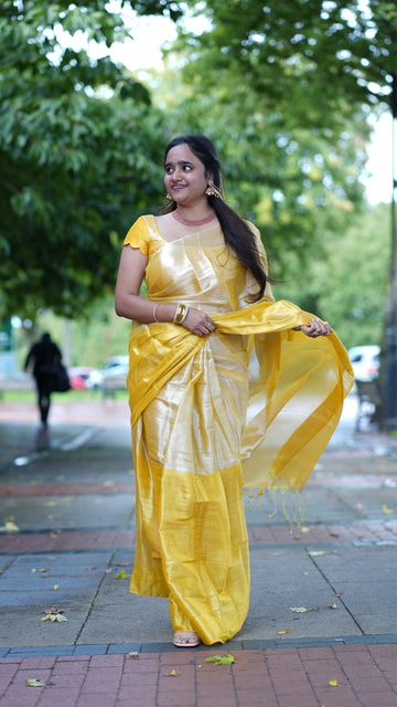 Radiant Yellow Handloom Tissue Cotton Saree with Shimmering Golden Zari Finish